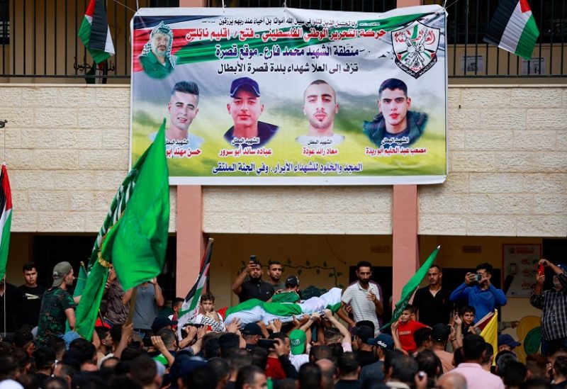 FILE PHOTO: SENSITIVE MATERIAL. THIS IMAGE MAY OFFEND OR DISTURB Mourners attend the funeral of four Palestinians killed in clashes with Israeli settlers, near Nablus in the Israeli-occupied West Bank October 12, 2023. REUTERS/Ammar Awad/File Photo