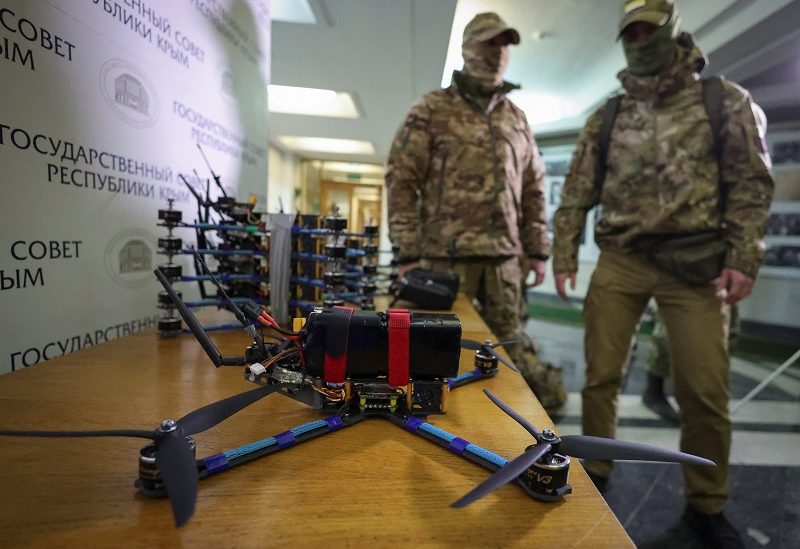 Russian servicemen receive combat FPV-drones assembled by volunteers by order of the Russia's Liberal Democratic Party (LDPR), during handing over ceremony in Simferopol, Crimea, November 9, 2023. REUTERS/Alexey Pavlishak
