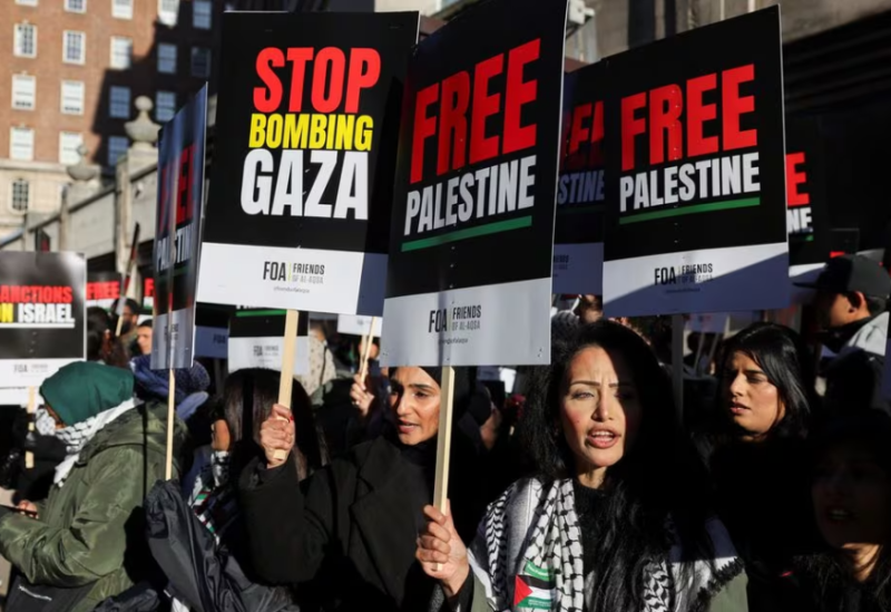 Demonstrators hold placards on the day of the protest in solidarity with Palestinians in Gaza, amid the ongoing conflict between Israel and the Palestinian Islamist group Hamas, in London, Britain, November 11, 2023