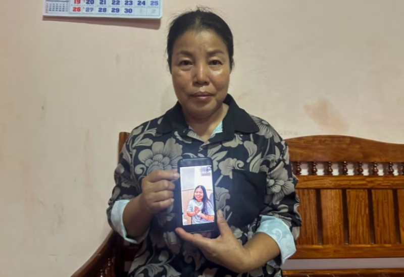 Bunyarin Srijan, the mother of a Thai hostage released as part of a hostages-prisoners swap deal between Hamas and Israel, holds her phone showing an image of her daughter, Natthawaree Mulkan, during an interview at her home in Khon Kaen, Thailand November 25, 2023