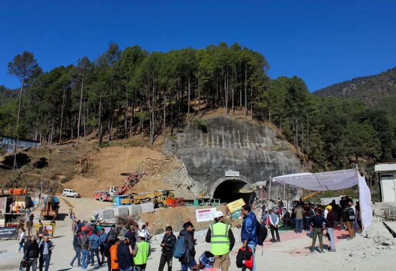 Media personnel and onlookers gather near the entrance of a tunnel under construction where workers are trapped following a collapse, in Uttarkashi, in the northern state of Uttarakhand, India, November 24, 2023. REUTERS/Rahul Grover NO RESALES. NO ARCHIVES