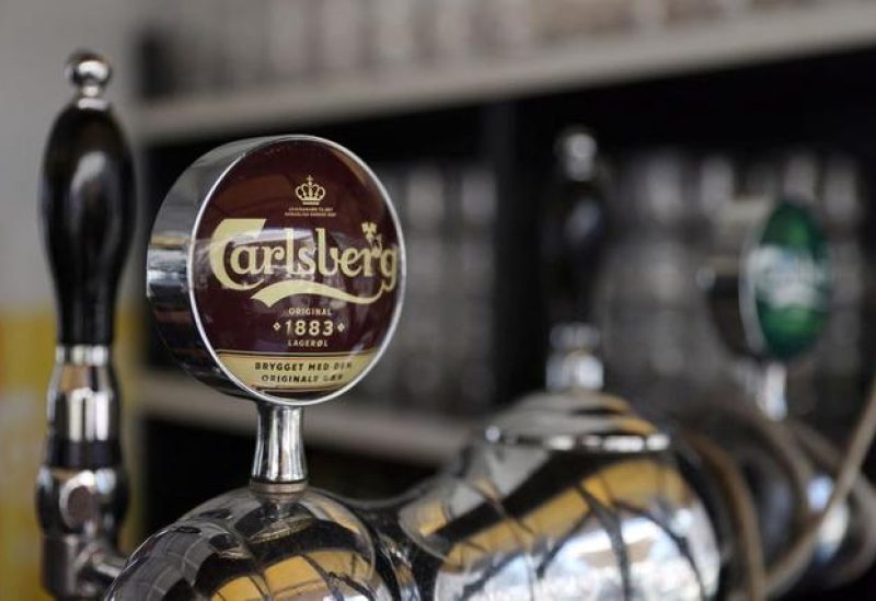 Taps for Carlsberg beer are seen in a bar in Copenhagen, Denmark, July 30, 2022. REUTERS/Andrew Kelly