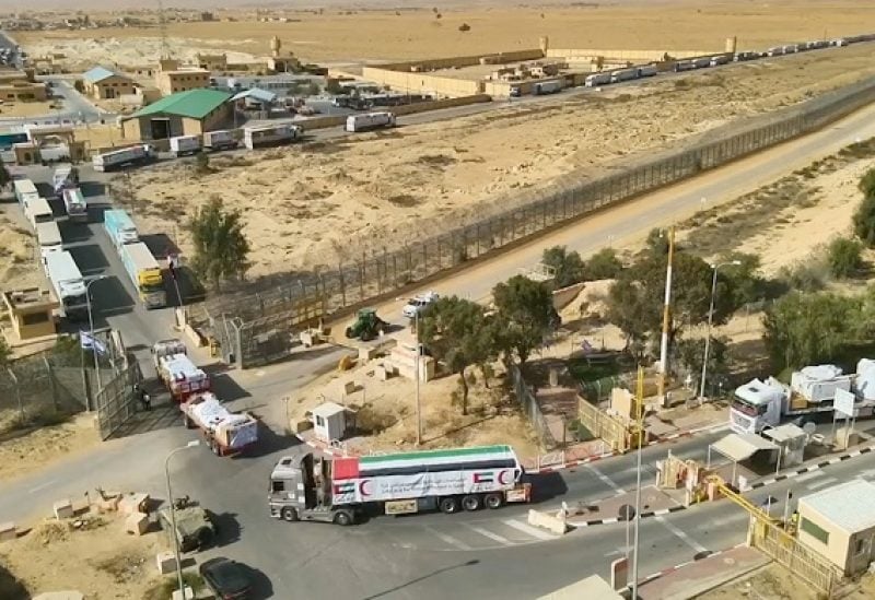 View of what the Israeli military says are trucks carrying humanitarian aid being transported to Gaza, during a temporary truce between Israel and Palestinian Islamist group Hamas, at a location given as the Border of Nitzana Crossing in this screen grab taken from a handout video released November 26, 2023. Israel Defense Forces/Handout via REUTERS THIS IMAGE HAS BEEN SUPPLIED BY A THIRD PARTY. REUTERS WAS NOT ABLE TO INDEPENDENTLY CONFIRM THE DATE WHEN THE VIDEOS WERE FILMED.