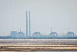 A view shows Zaporizhzhia Nuclear Power Plant from the bank of Kakhovka Reservoir near the town of Nikopol after the Nova Kakhovka dam breached, amid Russia's attack on Ukraine, in Dnipropetrovsk region, Ukraine June 16, 2023. REUTERS/Alina Smutko/File Photo
