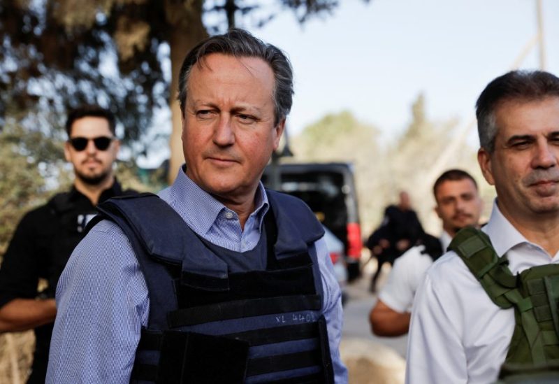 British Foreign Secretary David Cameron and Israeli Foreign Minister Eli Cohen visit Kibbutz Beeri following the October 7 deadly attack by Palestinian Islamist group Hamas, in southern Israel, November 23, 2023. REUTERS/Alexander Ermochenko