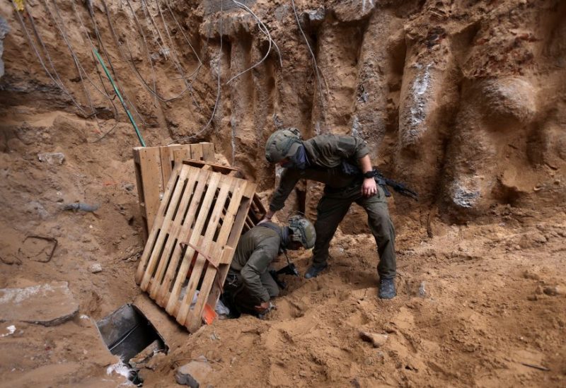 Israeli soldiers operate at the opening to a tunnel at Al Shifa Hospital compound in Gaza City, amid the ongoing ground operation of the Israeli army against Palestinian Islamist group Hamas, in the Gaza Strip, November 22, 2023. REUTERS/Ronen Zvulun/File Photo