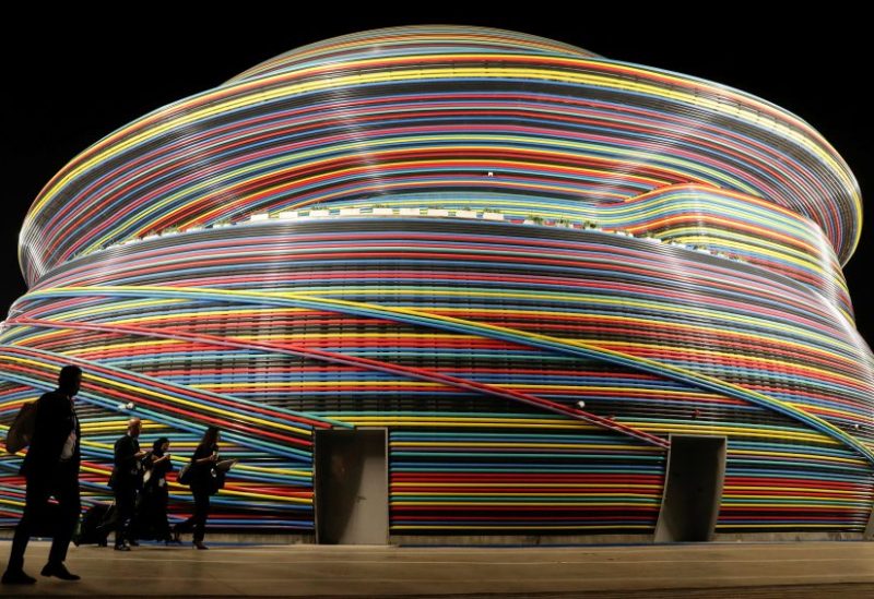 Delegates walk in front of the Russia Pavillion building at Dubai's Expo City during the United Nations Climate Change Conference (COP28) in Dubai, United Arab Emirates, December 6, 2023. REUTERS/Thomas Mukoya
