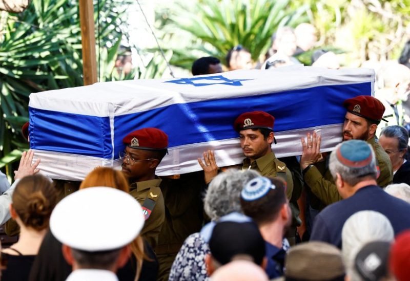 Pallbearers carry the coffin of Gal Meir Eisenkot, 25, an Israeli solider and the son of Israeli cabinet minister and former military chief Gadi Eizenkot, who was killed in northern Gaza during the ongoing ground operation by Israel's military in the Gaza Strip, during his funeral in Herzliya, Israel, December 8, 2023. REUTERS/Clodagh Kilcoyne