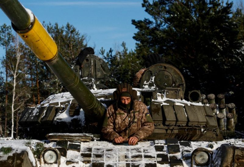 A Ukrainian serviceman sits in a tank during anti-sabotage drills, amid Russia's attack on Ukraine, in Chernihiv region, Ukraine December 5, 2023. REUTERS/Valentyn Ogirenko/File Photo