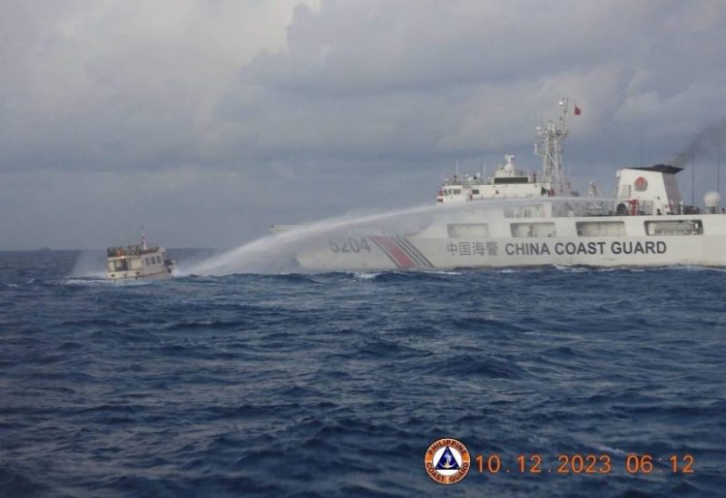 A Chinese Coast Guard ship uses a water cannon against a Filipino resupply vessel heading towards the disputed Second Thomas Shoal, in the South China Sea, December 10, 2023. Philippine Coast Guard/Handout via REUTERS