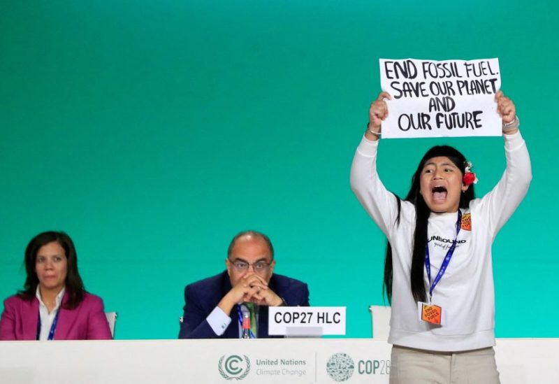 Licypriya Kangujam, an Indigenous climate activist from India, holds a banner during the United Nations Climate Change Conference (COP28) in Dubai, United Arab Emirates, December 11, 2023. REUTERS/Thomas Mukoya/File Photo