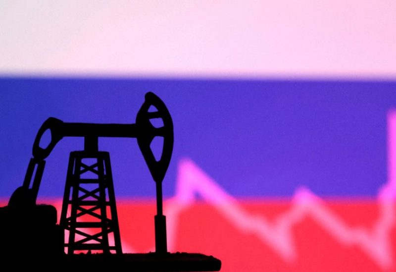 Russian flag with stock graph and an oil pump jack miniature model are seen in this illustration taken October 9, 2023. REUTERS/Dado Ruvic/Illustration/File Photo