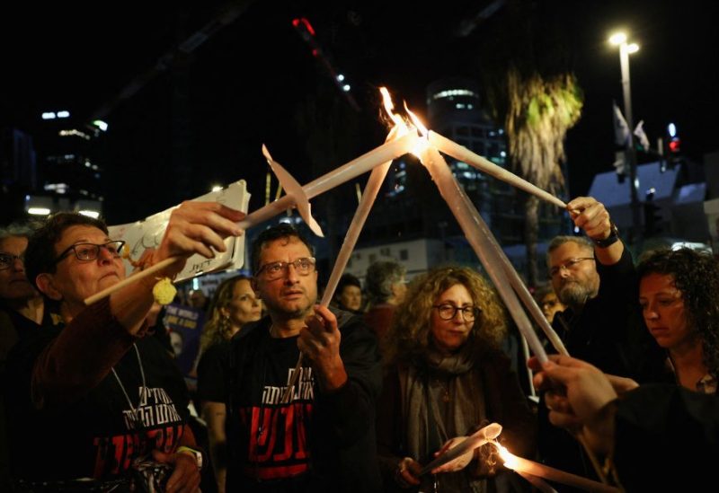 People light candles as they protest following an announcement by Israel's military that they had mistakenly killed three Israeli hostages being held in Gaza by Palestinian Islamist group Hamas, at a demonstration in Tel Aviv, Israel, December 15, 2023. REUTERS/Violeta Santos Moura