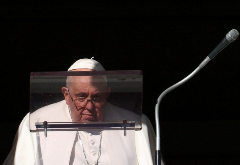 Pope Francis looks on to lead the Angelus prayer from his window, at the Vatican, December 17, 2023. REUTERS/Guglielmo Mangiapane