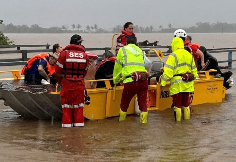 A supplied image obtained on Monday, December 18, 2023, shows State Emergency Service personnel evacuating people from flood waters in far north Queensland, Australia following heavy rain and flooding from ex-tropical cyclone Jasper. AAP Image/Supplied by QFES via REUTERS