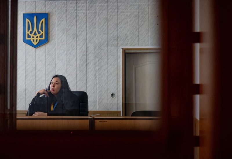 Judge Olha Konoplenko presides over a hearing, to which defendants and plaintiffs dial in remotely, in a courthouse in a town near the front line, in the Donetsk region, amid Russia’s attack on Ukraine, December 13, 2023. REUTERS/Thomas Peter