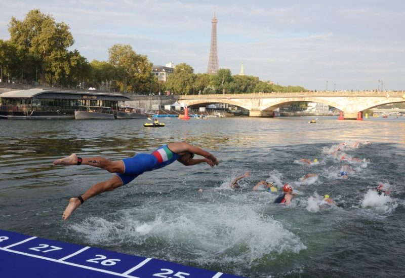 Olympics - Paris 2024 holds triathlon test event for the Olympics - Paris, France - August 18, 2023 General view as athletes compete in the elite men triathlon test event in the river seine REUTERS/Stephanie Lecocq/File Photo