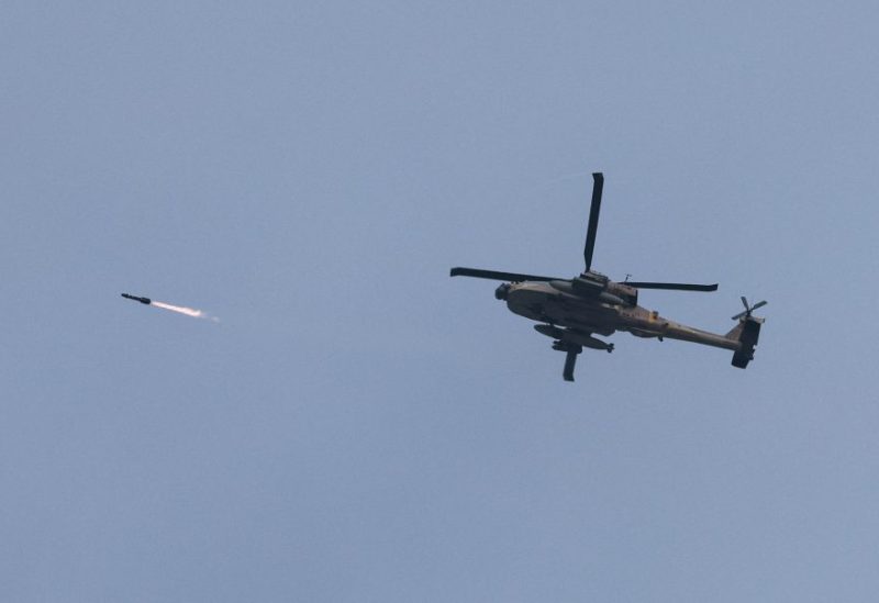 An Israeli military Apache helicopter fires a missile near Israel-Gaza border, amid the ongoing conflict between Israel and the Palestinian Islamist group Hamas, as seen from southern Israel, December 23, 2023. REUTERS/Violeta Santos Moura