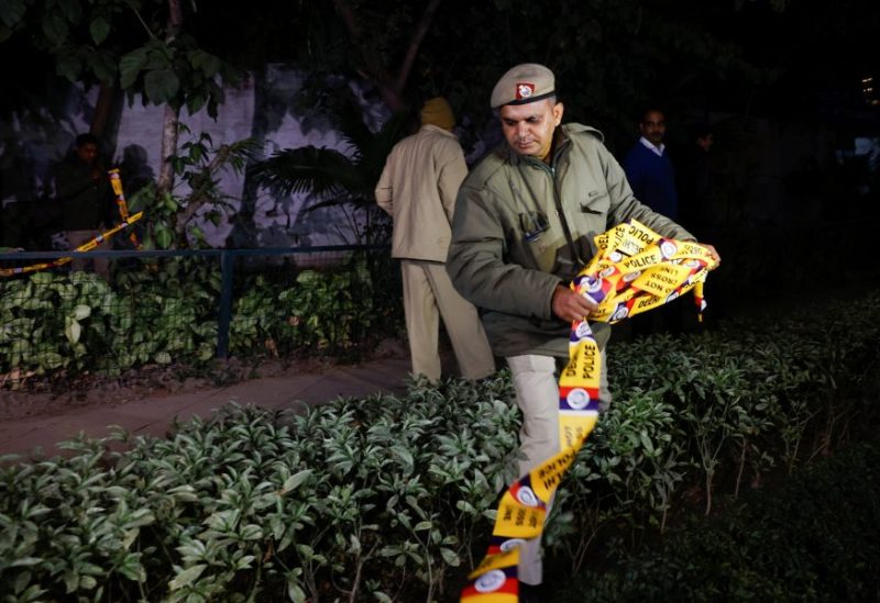 A police officer removes the security tape outside the Israeli embassy, following an investigation on a reported explosion nearby, in New Delhi, India, December 26, 2023. REUTERS/Anushree Fadnavis