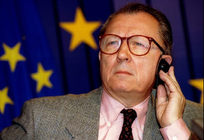 European Union President Jacques Delors listens to a question during a press conference on the book "In search of Europe" October 21, 1994, at the EU headquarters. REUTERS/Nathalie Koulischer/File Photo