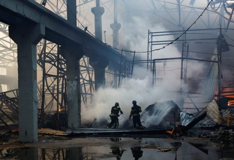 Firefighters work at a site of a warehouse heavily damaged duringa Russian missile strike, amid Russia's attack on Ukraine, in Kyiv, Ukraine December 29, 2023. REUTERS/Valentyn Ogirenko