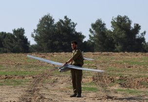 An Israeli military tactical drone operator prepares to launch a drone near the Gaza border, amid the ongoing conflict between Israel and the Palestinian Islamist group Hamas, in southern Israel, December 30, 2023. REUTERS/Violeta Santos Moura