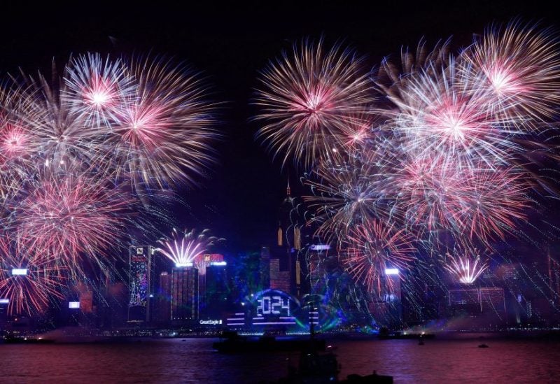 Fireworks explode over Victoria Harbour to celebrate the New Year in Hong Kong, China January 1, 2024. REUTERS/Tyrone Siu