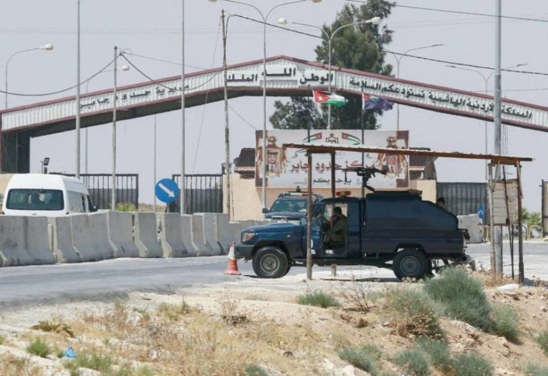 (FILES) This file photo taken on August 1, 2021 shows Jordanian troops guarding the closed Jaber/Nassib border post on Jordan's border with Syria. (Photo by Khalil MAZRAAWI / AFP)