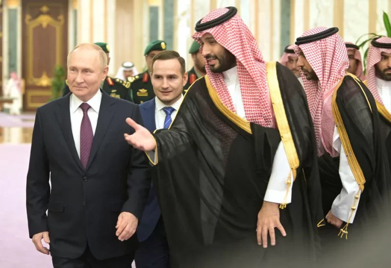 Russian President Vladimir Putin and Saudi Crown Prince Mohammed bin Salman walk during a meeting in Riyadh, Saudi Arabia December 6, 2023