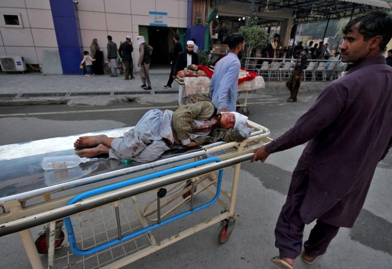 SENSITIVE MATERIAL. THIS IMAGE MAY OFFEND OR DISTURB An injured person is rushed to a hospital for treatment after he was wounded in an explosion, in Peshawar, Pakistan, December 5, 2023. REUTERS/Khuram Pervez NO RESALES. NO ARCHIVES