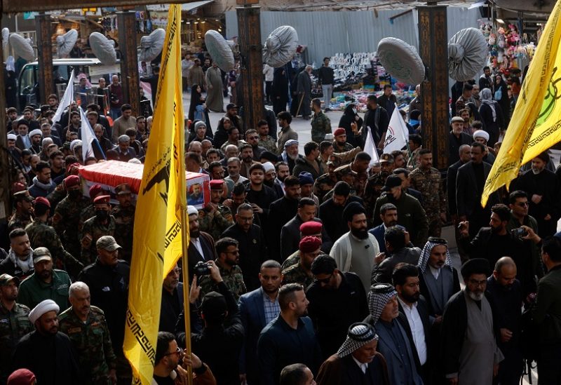 People carry the coffin of senior adviser for Iran's Revolutionary Guards, Sayyed Razi Mousavi, who was killed in an Israeli air strike outside the Syrian capital Damascus, during his funeral in Najaf, Iraq, December 27, 2023. REUTERS/Alaa al-Marjani