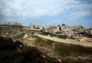 The Israeli barrier winds around the outskirts of the East Jerusalem refugee camp of Shuafat, in an area Israel annexed to Jerusalem after capturing it in the 1967 Middle East war, December 28, 2023. REUTERS/Ammar Awad