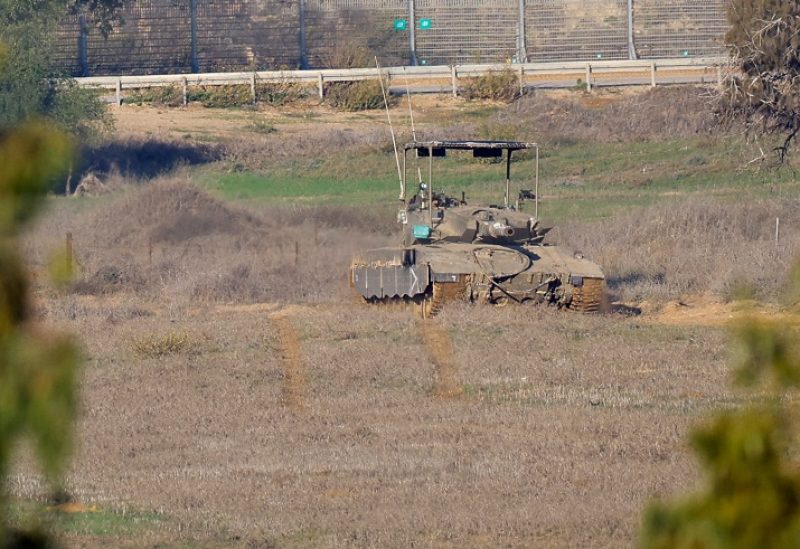 Israeli soldiers operate a tank near Gaza, after a temporary truce between Israel and the Palestinian Islamist group Hamas expired, as seen from southern Israel, December 3, 2023. REUTERS/Alexander Ermochenko