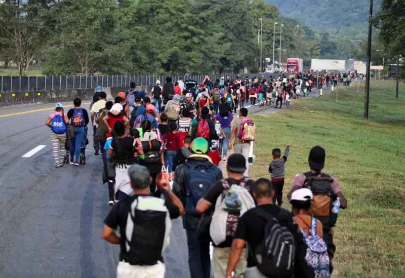 Migrants continue walking in a caravan in an attempt to reach the U.S. border, in Escuintla, Mexico, December 28, 2023. REUTERS
