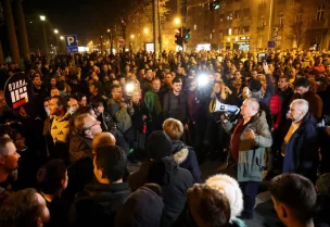 Srdjan Milivojevic, from the Democratic Party, speaks outside of Belgrade city police department, where some protesters were taken, during a protest after the 'Serbia Against Violence' (SPN) coalition alleged major election law violations in the Belgrade city and parliament races, in Belgrade, Serbia, December 25, 2023. REUTERS