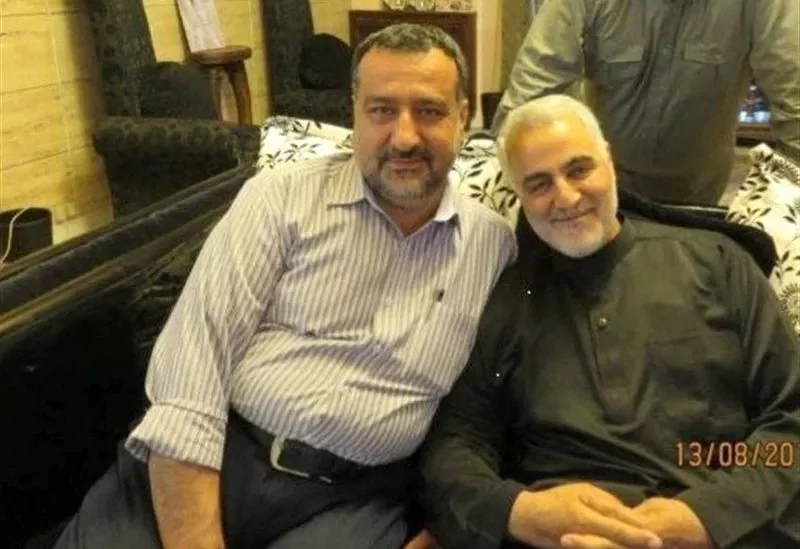 Senior adviser for Iran's Islamic Revolutionary Guard Corps, Sayyed Razi Mousavi, sits next to late Iranian Major-General Qasem Soleimani in an unknown location, in this handout image obtained on December 25, 2023. Tasnim News/WANA (West Asia News Agency)/Handout via REUTERS