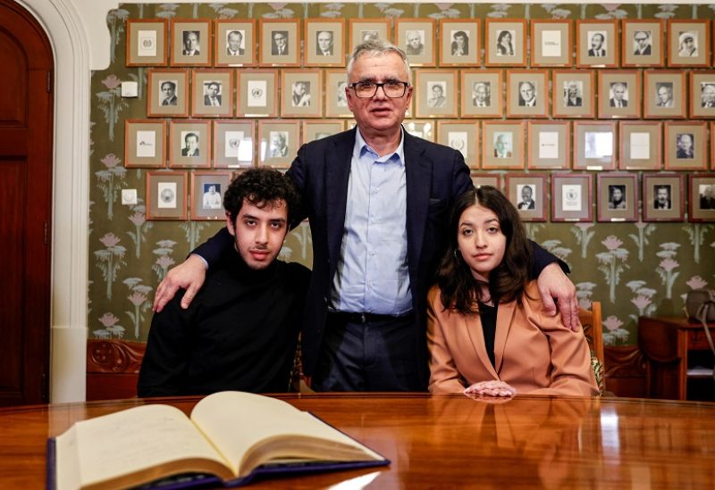 The husband and children of this year's winner of the Nobel Peace Prize, Ali, Taghi and Kiana Rahmani pose for pictures after signing the guest book at the Nobel Institute in Oslo, Norway, December 9, 2023. Peace Prize winner Narges Mohammadi is imprisoned and is therefore represented by his immediate family. Mohammadi receives the peace prize for his fight against the oppression of women in Iran and the fight for human rights and freedom for all. The prize is awarded during a ceremony in Oslo City Hall. Frederik Ringnes/NTB/via REUTERS ATTENTION EDITORS - THIS IMAGE WAS PROVIDED BY A THIRD PARTY. NORWAY OUT. NO COMMERCIAL OR EDITORIAL SALES IN NORWAY.