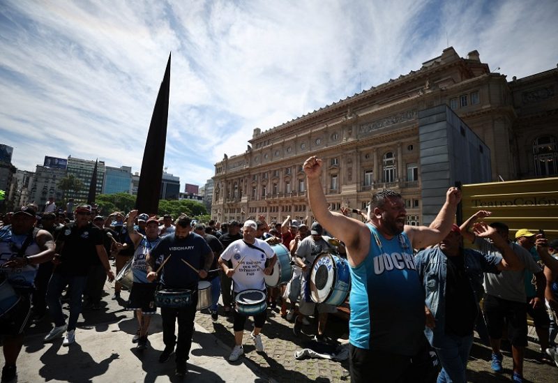 Demonstrators protest against Argentina's new President Javier Milei's economic reforms, outside the Teatro Colon opera house, near the Justice Palace in Buenos Aires, Argentina December 27, 2023. REUTERS/Agustin Marcarian