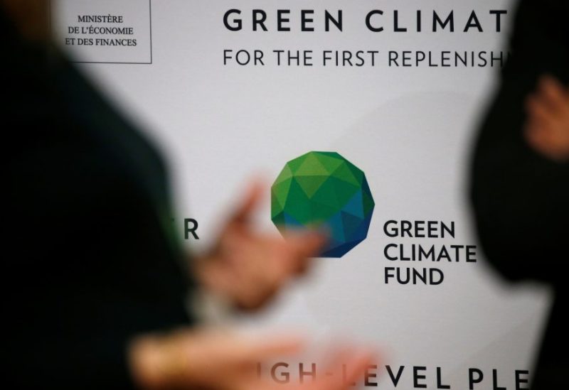 People arrive to attend the Pledging Conference of the Green Climate Fund (GCF) for the First Replenishment in Paris, France, October 25, 2019. REUTERS/Pascal Rossignol/File Photo